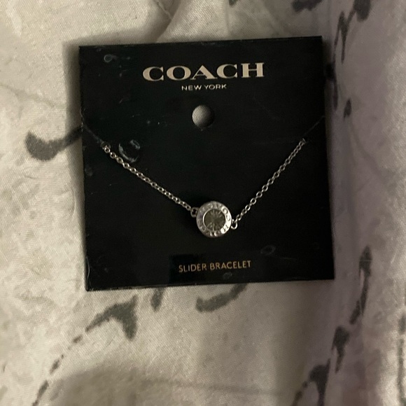 It’s a bracelet and it’s silver and it’s from coach and it’s new never been used - Picture 3 of 4